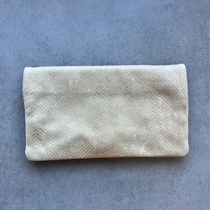 Snake print fold-over clutch